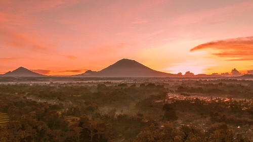 Sunrise over the rice terraces with Mt. Agung in the Background in Ubud, Bali, Indonesia