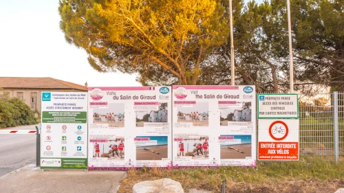 French signs at the pink salt lakes at Salin de Giraud in the South of France