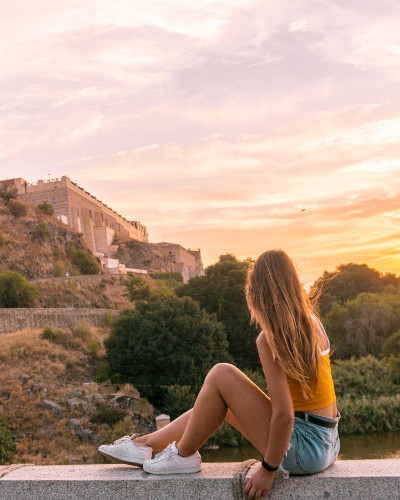 Sunset at Instagrammable place Alcantara Bridge in Toledo, Spain